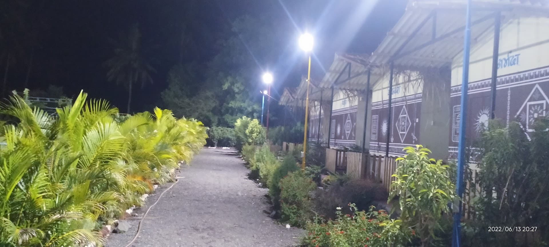 Illuminated night path at Yugankur Farmhouse