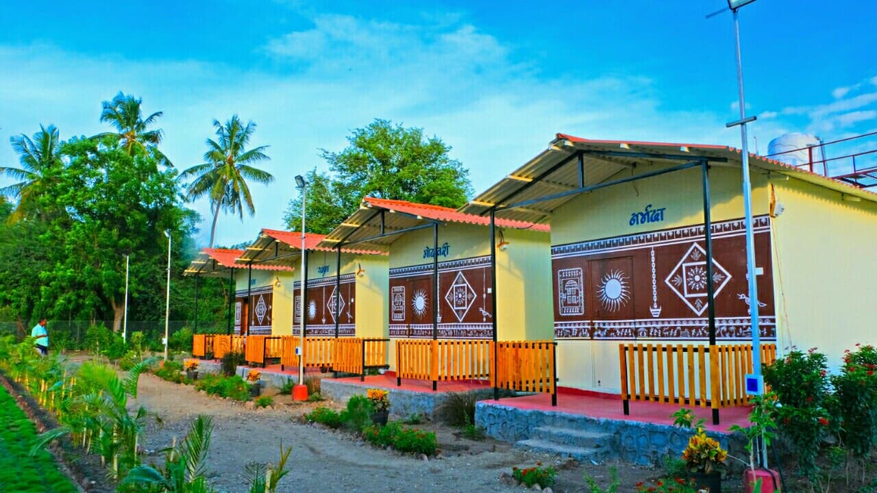 Yugankur Farmhouse — colorful traditionally decorated cottages