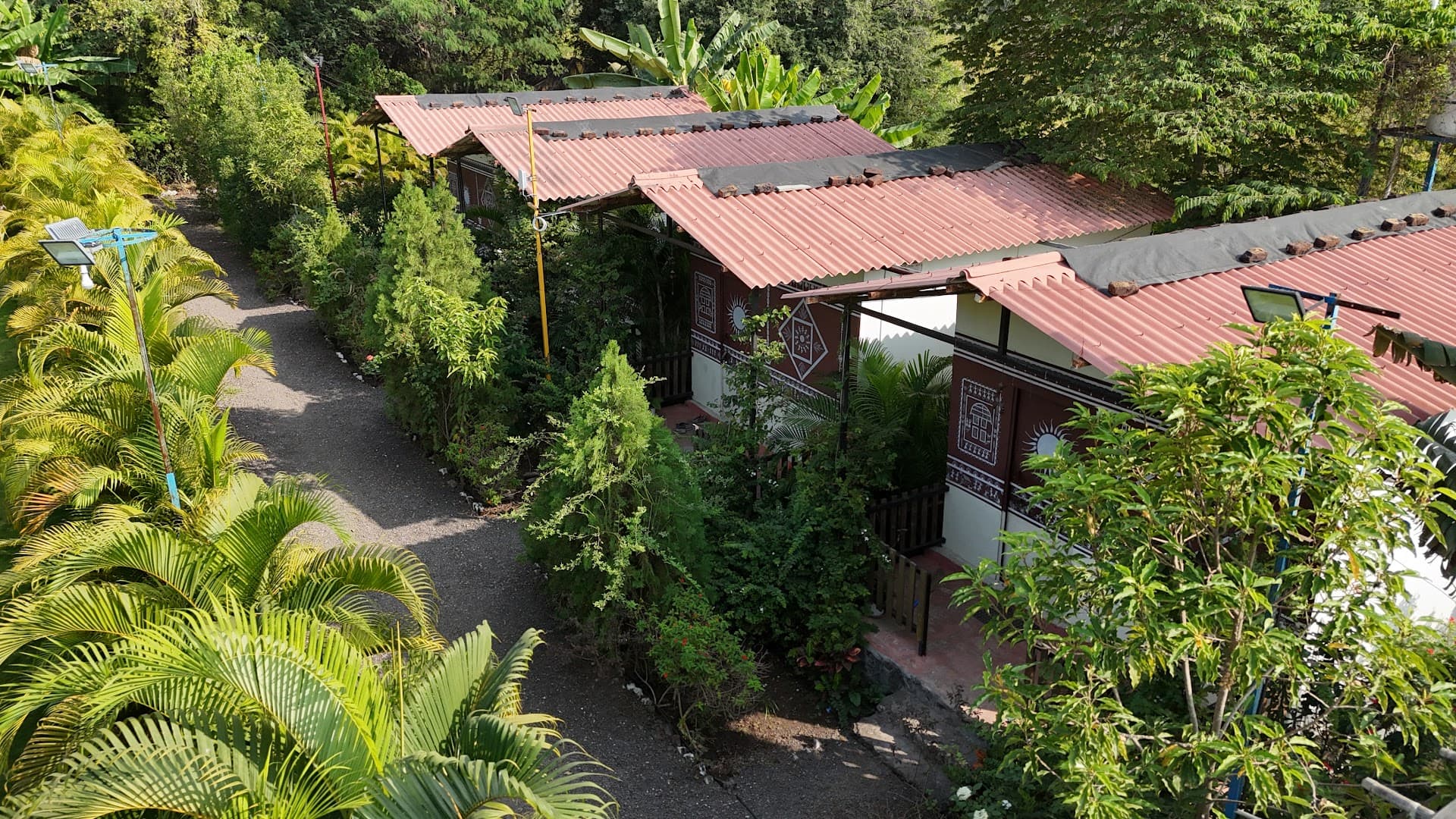 Lush greenery and walking paths at Yugankur Farmhouse